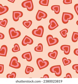 Seamless pattern of red and pink hearts. Cartoon elements in trendy retro style on pink background. Vector illustration
