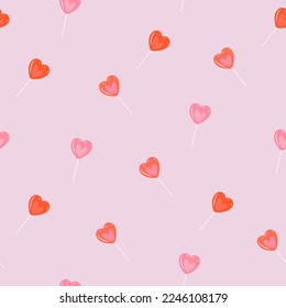 Seamless pattern with red and pink lollipop hearts. Vector graphics.