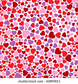 seamless pattern with red, pink and violet hearts