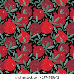 Seamless pattern with red pomegranate fruits and seeds on black background. Juicy tropical fruits. Design wallpaper, fabric, wrapping paper or decoration. Hand drawn illustration in vintage style
