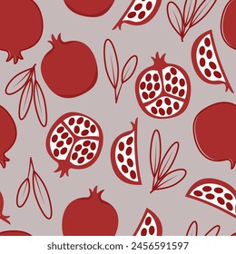 Seamless pattern of red pomegranates with leaves on a gray trendy background 