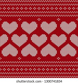 Seamless pattern red and white knitted background with hearts. Knitted pattern on a red background. Ornament. Valentine's Day background. Sweater texture hearts seamless