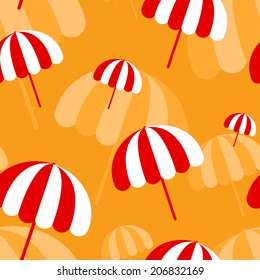 Seamless pattern with red and white parasols on orange background