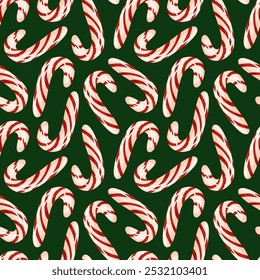 Seamless pattern with red and white striped candy cane on a green background. Ideal for Christmas design, holiday wrapping paper or festive decorations.