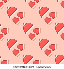 Seamless pattern with red winter knitted hat and mittens on orange background. Vector texture.