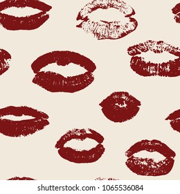 Seamless pattern with red women's lips on pink background