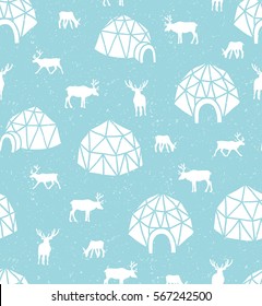 Seamless pattern with reindeer and igloo. Arctic blue surface design. Winter background.