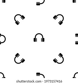 Seamless pattern of repeated black headphones symbols. Elements are evenly spaced and some are rotated. Vector illustration on white background