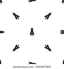 Seamless pattern of repeated black rockets. Elements are evenly spaced and some are rotated. Vector illustration on white background