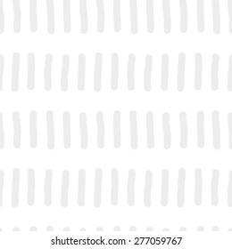 Seamless pattern with repeating elements freehand drawing vertical short rods similar to worms standing in a row of gray on a white background