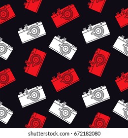 Seamless pattern with a retro film camera on a black background. Decor for textiles, wrapping paper, scrapbooking. Flat vector cartoon illustration. Objects isolated.