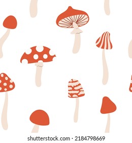 Seamless pattern with retro mushrooms, Digital paper with mushrooms, Endless backgrounds with red mushrooms, Groovy vector illustration clipart.