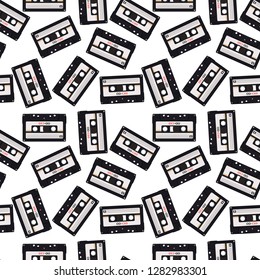 Seamless pattern in retro style with audio cassettes
