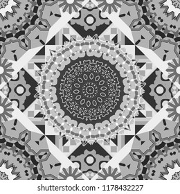 Seamless pattern with rhombus and polygons forming abstract wallpaper. Stylish gray, black and white texture. Vector abstract geometric background.