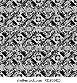 Seamless pattern with rhombus and polygons forming abstract wallpaper. Stylish white, black and gray texture. Vector abstract geometric background.