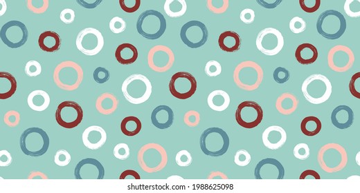 Сolorful seamless pattern with rings in brush stroke technique. Vector abstract background with random hand painted circles.