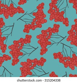 Seamless pattern with ripe rowan on a blue background. Vector illustration