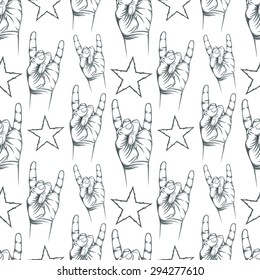 Seamless pattern with Rock n Roll sign and a stars. Vector illustration.