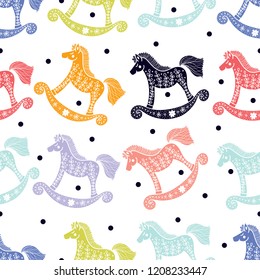 Seamless pattern with rocking horses. Cute baby shower background.Cloth, wallpaper, wrapping, fabric, print , surface, baby shower design.