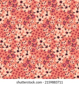 Seamless pattern with romantic flower meadow, small hand drawn plants on a pink field. Cute floral print, botanical background with tiny flowers, leaves. Vector illustration.