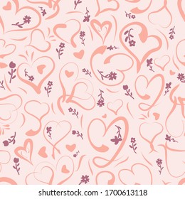 Seamless pattern of romantic heart shaped motifs in a calligraphy style.