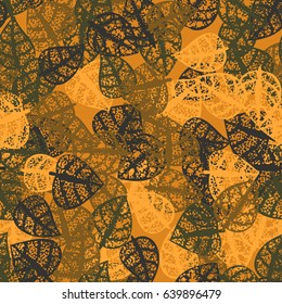 Seamless pattern. Rotten leaves arranged randomly. Fashionable camouflage. Orange, khaki, gray.