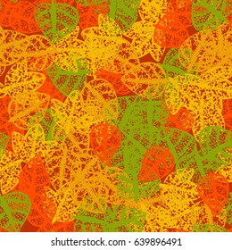 Seamless pattern. Rotten leaves arranged randomly. Fashionable camouflage. Red,  orange, green, yellow.