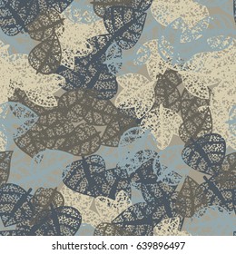 Seamless pattern. Rotten leaves arranged randomly. Fashionable camouflage. Grey, beige, gray-blue, brown.