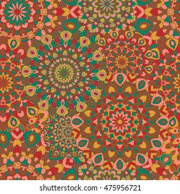 Seamless pattern with round colored mandalas. Texture with a Romany ornament.