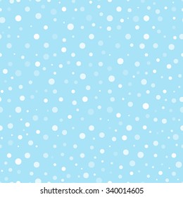 Seamless pattern with round snowflakes varying transparency on blue background