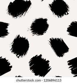 Seamless pattern with round wide brush strokes on cream background. Monochrome hand drawn ink texture circles. Stylish polka dot design.