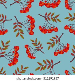 Seamless pattern with rowan berries and leaves on blue. Vector background.