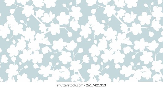 Seamless pattern of sakura flowers and branches on a blue background. Vector illustration.