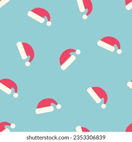 Seamless pattern with Santa Claus hats on a blue background. winter vector illustration.