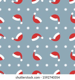 Seamless pattern santa hats and snowflakes. Vector.