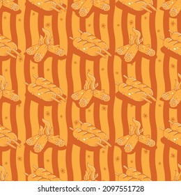 Seamless pattern with sausages and bonfires. Cute vector illustration.