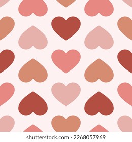 Patrón sin foco con corazones rosados, beige y marrón dispersos