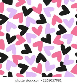 Seamless pattern with scattered pink, purple and black hearts