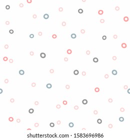 Seamless pattern with scattered small circles. Simple girly print. Vector illustration.