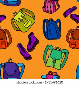 Seamless pattern in school style. School briefcases and backpacks
