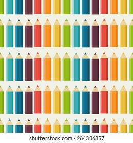 Seamless pattern with a set of colored pencils isolated on a white background