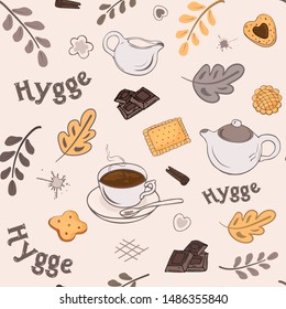 Seamless pattern with a set of elements in the Scandinavian style of hyggo with warm tea, pastries and autumn leaves.