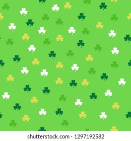 Seamless pattern with shamrocks in green colors. Saint Patrick's Day Holiday background. Vector.