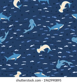 Seamless pattern sharks on blue background. Cute print with Hammerhead, Whale, White shark and fishes. Funny underwater animals for childish fabric. Vector illustration design.