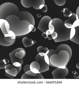 Seamless pattern with shining bokeh random hearts on black background