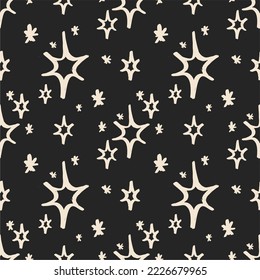 Seamless pattern with shining stars, sparkles on a dark background. Unique print in boh style. Ideal for fabric template, cover, wrapper or postcard.