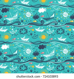 Seamless pattern with ships, fish, whales, starfish and sea waves. Drawn in a children's style.