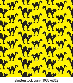 Seamless pattern with silhouette of black cats and yellow backround. Vector illustration.