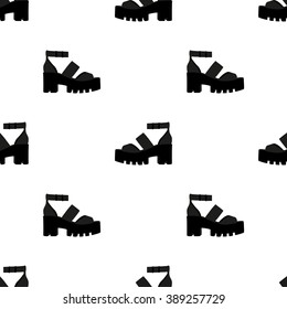 Seamless pattern with silhouette of fashionable footwear on a thick platform heel. In two colors black silhouette of shoes on a white background.