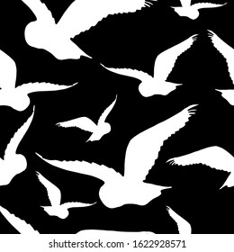 Seamless pattern with the silhouette of a flying owl on a light sky background. Dark ink hand drawn logo in art style vintage engraving graphic style. Close up view with space for text.